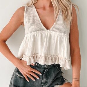 RESTOCKED Best Seller: Sleeveless babydoll Cream hemline ruffle  top.